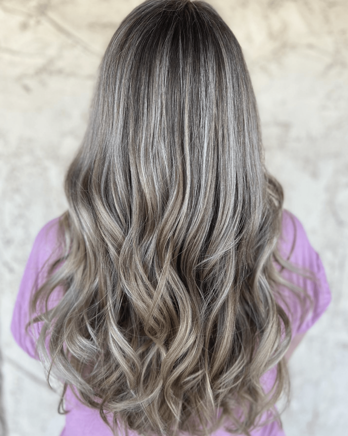 Cool toned bronde balayage with soft waves, colored at Studio One Six in Las Cruces