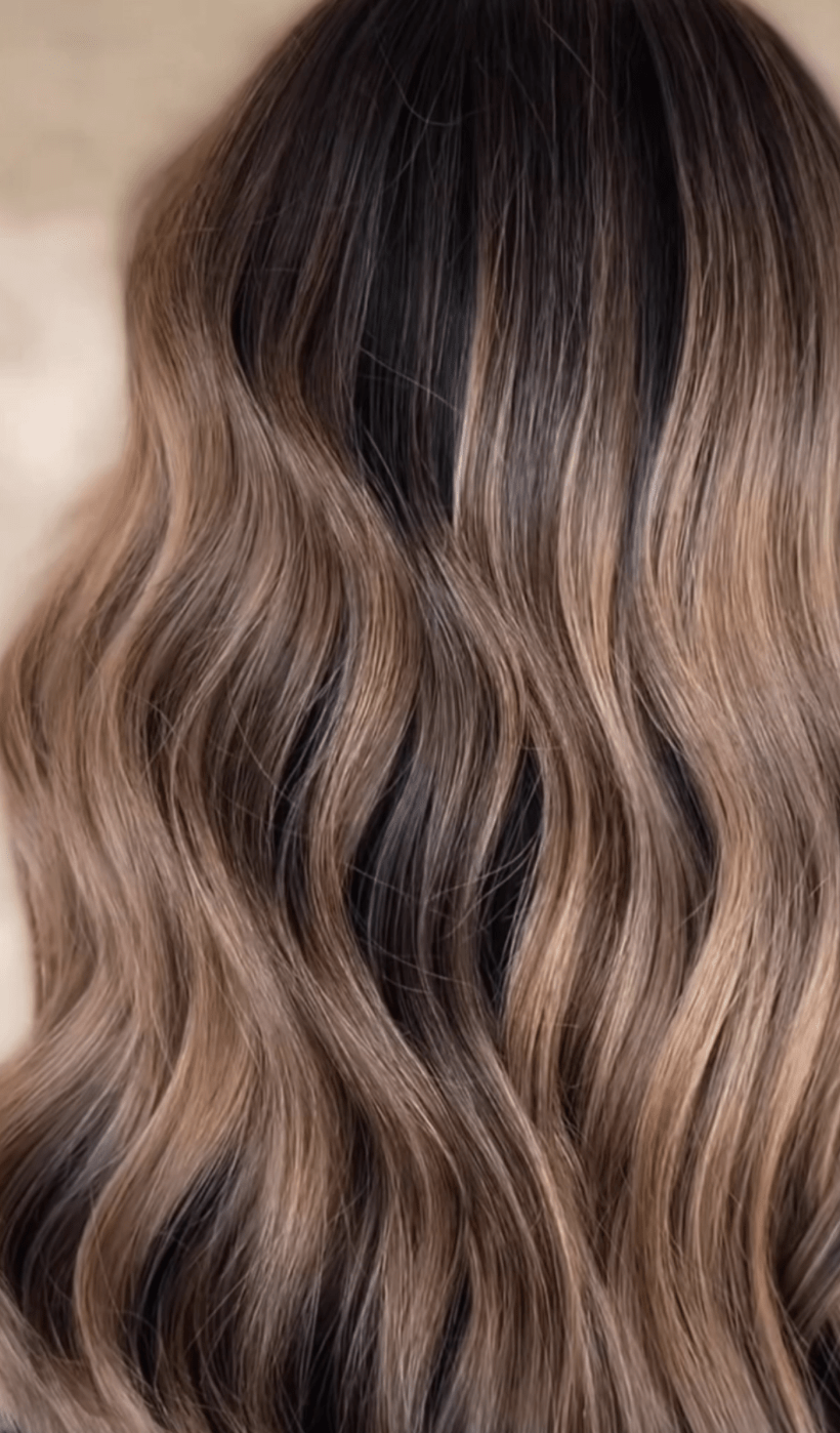 Close up of honey caramel balayage waves, colored at Studio One Six in Las Cruces